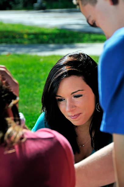 istock Pretty Female Student Studies with Friends 186863057