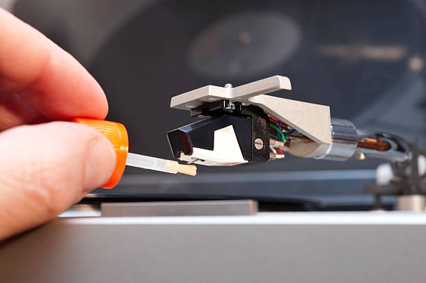 Cleaning a Record Player Stylus Using a brush and  fluid to clean the stylus. record player needle stock pictures, royalty-free photos & images