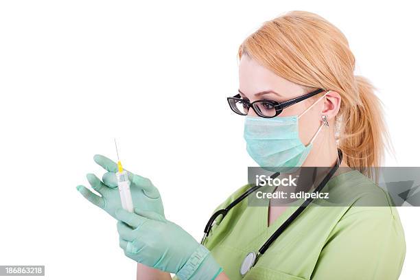 Young Blond Nurse With Syringe Stock Photo - Download Image Now - Adult, Adults Only, Analyzing