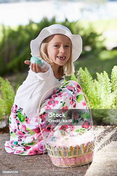 Pretty Little Girl Holding Easter Egg Stock Photo - Download Image Now - 6-7 Years, Animal Egg, Basket