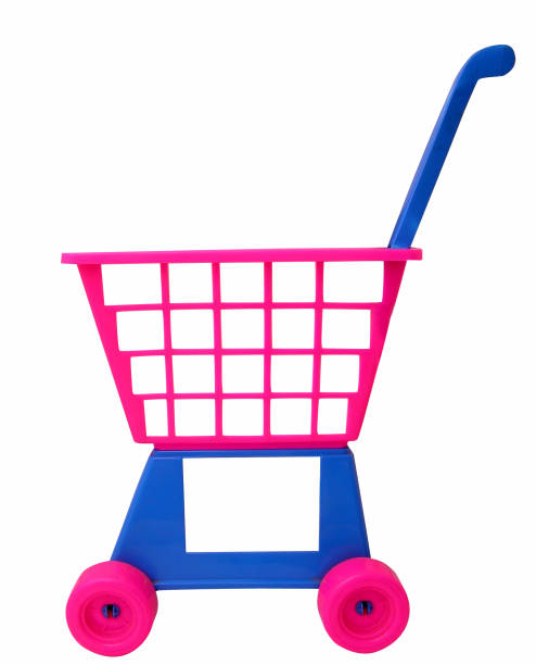 Toddler boy pushing his twin sister in a toy cart isolated on white background