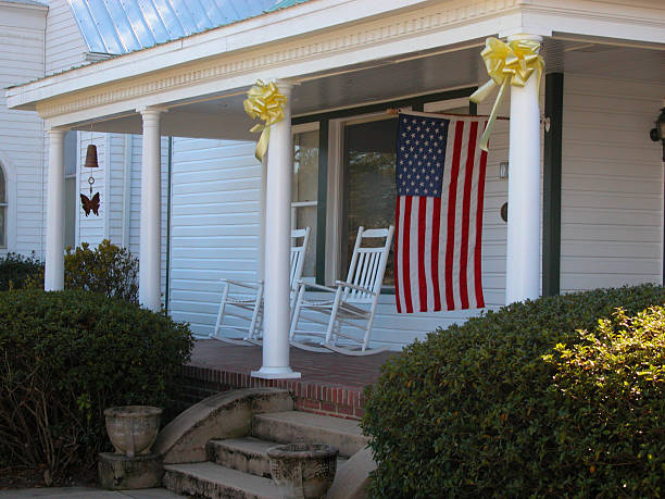 istock Historic house porch and flag 186864280