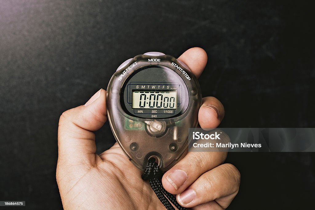 stop watch Coach holding up a stopwatch. Stopwatch Stock Photo