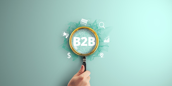 B2B Business. Navigating the Technology-Driven Terrain of Commerce and Marketing with Digital Marketing Expertise. Magnifier focus to Digital marketing icon.