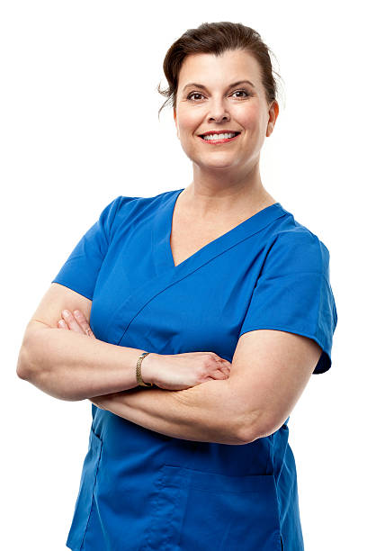 Happy Smiling Woman In Scrubs Portrait of a woman on a white background. http://s3.amazonaws.com/drbimages/m/verhoo.jpg medical scrubs stock pictures, royalty-free photos & images
