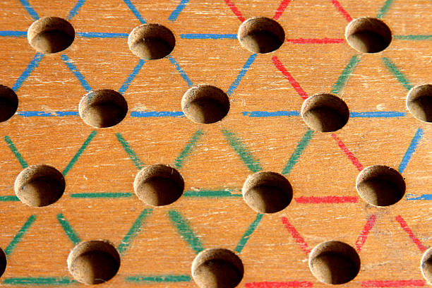 Chinese Checker Board Closeup of a wooden chinese checker board. chinese checkers stock pictures, royalty-free photos & images