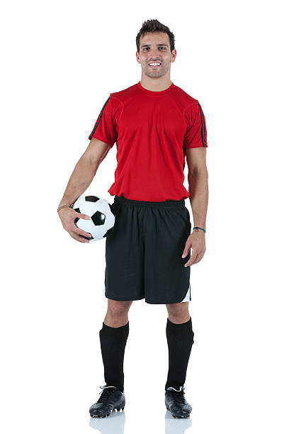 ritratto di uomo che tiene un pallone da calcio - t shirt men red portrait foto e immagini stock