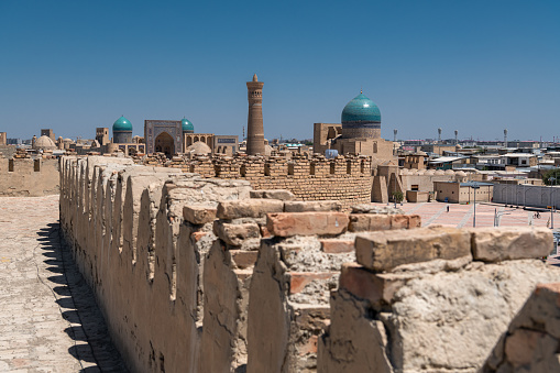 The Ark of Bukhara inside walls. The Ark Citadel is an ancient massive fortress located in Bukhara city, Uzbekistan. Blue sky with copy space for text