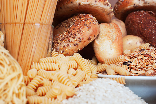Food high in carbohydrates,, rice,, pasta,, cereal,, bread,, bagel,, noodle.