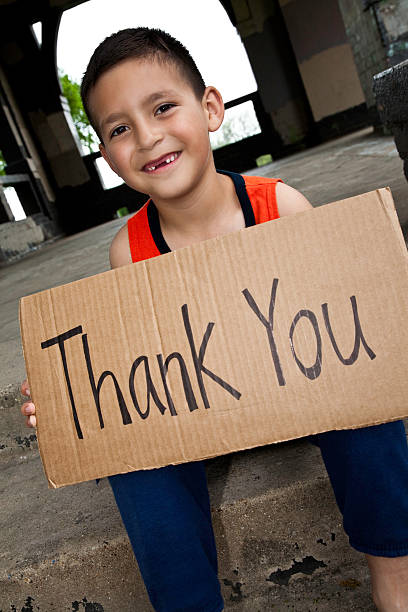istock Thank You Sign Held By Cute Hispanic Boy 186865506