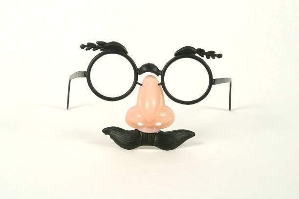 Groucho Marx Glasses Mustache Disguise - Front "Groucho Marx Glasses Front. Very cheep plastic eyglasses with eyebrows, nose and mustache attached. Clipping path included to separate from background. Add these to your favorite face picture!!" groucho marx disguise stock pictures, royalty-free photos & images