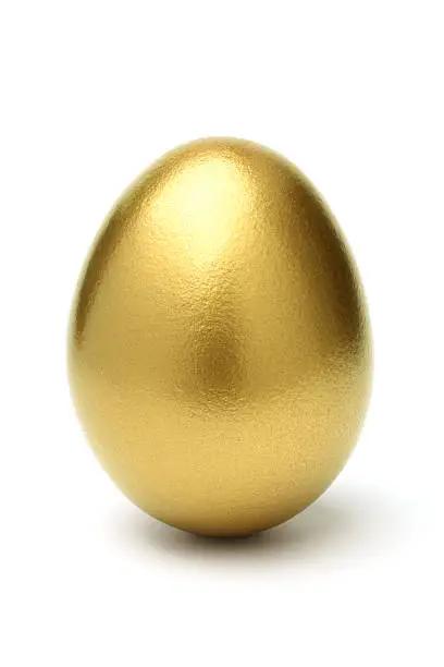 "Golden egg, isolated on white background."