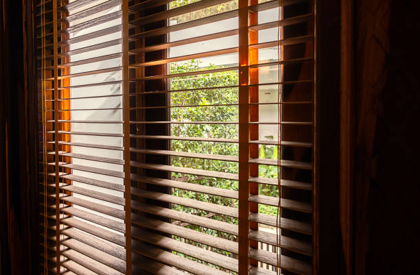istock Open wooden window blinds, close up. 1868668781