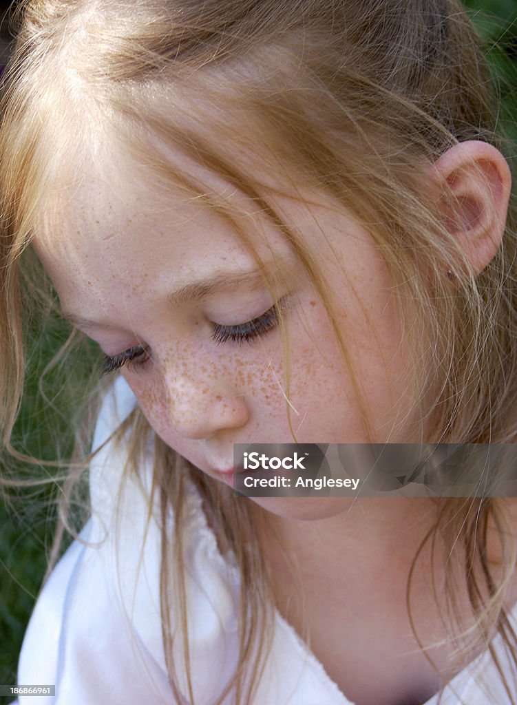 adorable pout adorable little girl with long eyelashes pouting and looking down. Angel Stock Photo