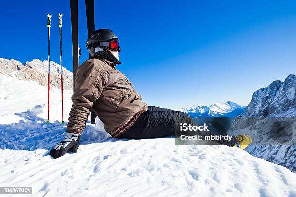 Skier Resting On Top Of Ski Resort Stock Photo - Download Image Now - On Top Of, Only Men, Adult