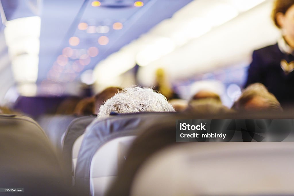 Con Avión volando - Foto de stock de Asiento libre de derechos