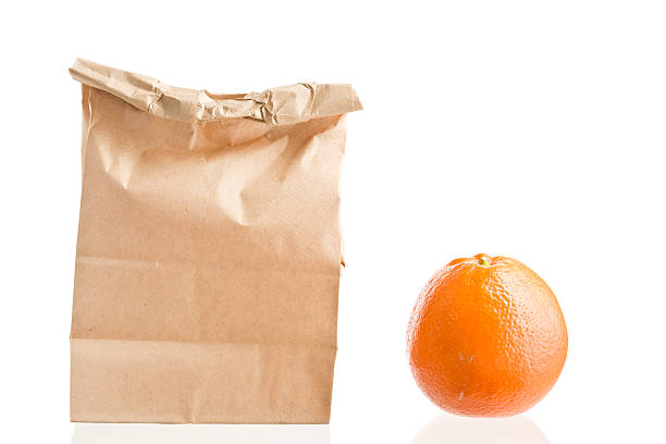 istock Brown Bag Lunch And An Orange 186867243
