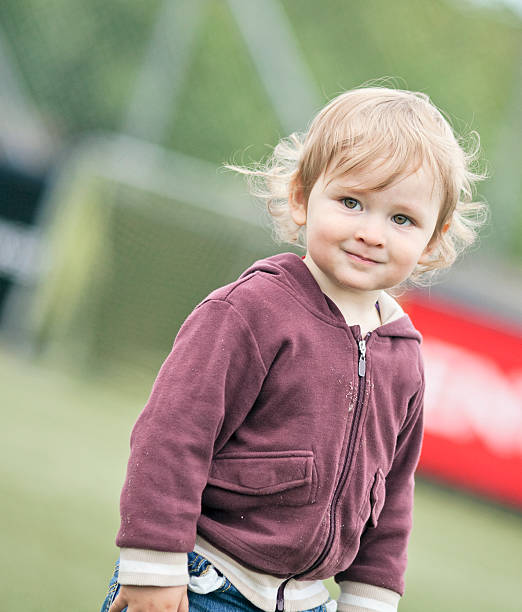istock Small boy on football field 186867344