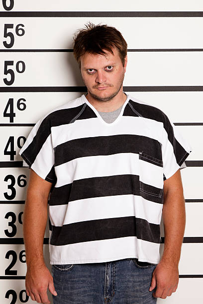 istock Mugshot of a Young Man in Prison Uniform 186867411