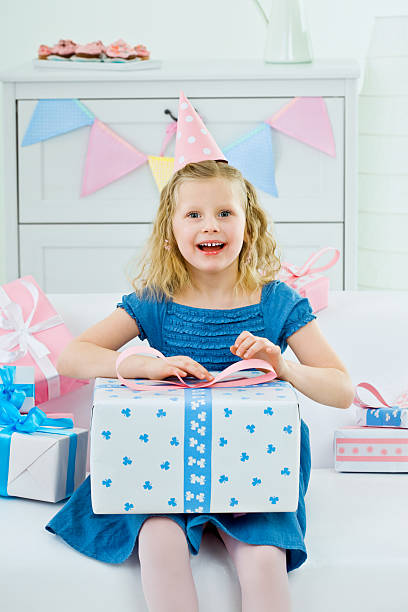 istock Cute girl with birthday present 186867430