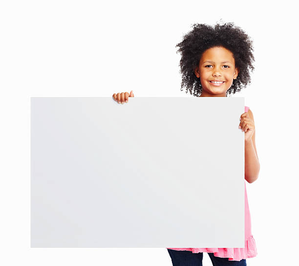 istock Smiling girl holding white poster isolated against 186867645