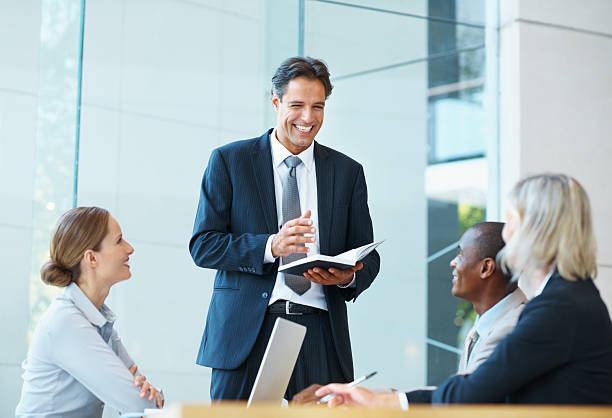 istock Business man smiling during a meeting 186867764