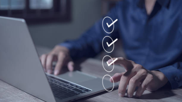 istock Smart checklist concept on virtual screen A man uses a marker to explore topics in a digital form review document. 1868680152