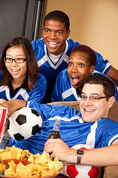 istock Soccer fans at home watching the game 186868460