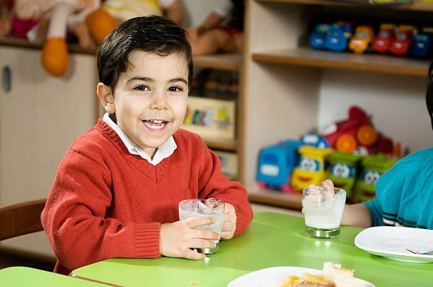 Preschoolers Little boy is drinking milk. hrant dink stock pictures, royalty-free photos & images