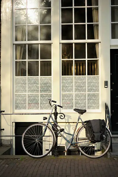 Photo of Bicycle Parked Outside Elegant Canal House