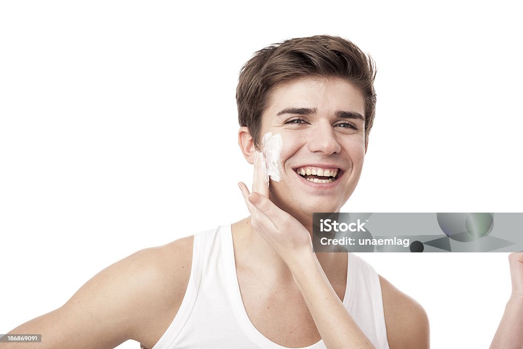 man using facial cream with woman help "man using facial cream, helped by a woman" Adult Stock Photo