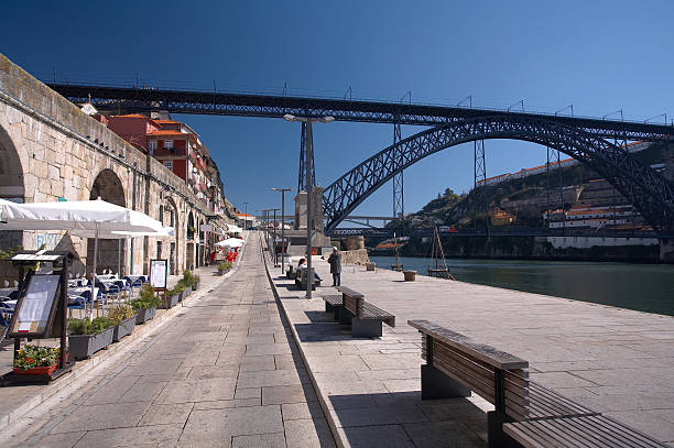 Porto panorama - view to the Dom Luis I Bridge and the Douro river. Blue cloudy sky is on the background.