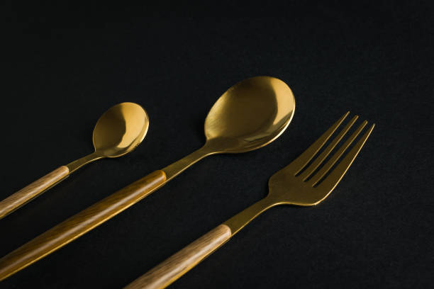 istock A set of dining items on a black background. 1868694139