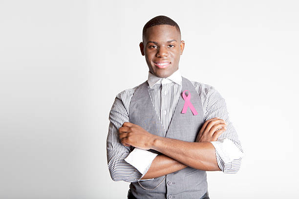istock Smiling Man Supporting Breast Cancer Awareness 186869470