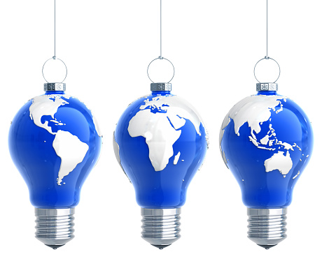 Chirstmas balls looks like light bulbs with a world map. Concept design. Isolated on white with clipping path. 3D render.