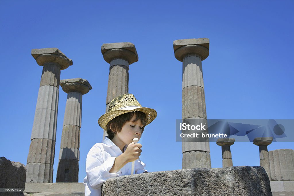 Little archaeologist "Little cute archaeologist at ruins of doric temple of Athena in Assos (Behramkale), Turkey" Ancient Greece Stock Photo