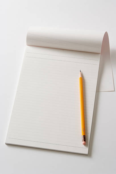 istock Isolated shot of blank notebook with pencil on white background 186870482