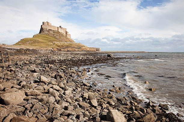 istock Lindisfarne Castle and Pebble Beach 186870632