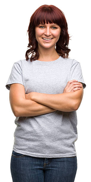 smiling young woman crosses arms - orta uzunlukta saç kesim stok fotoğraflar ve resimler