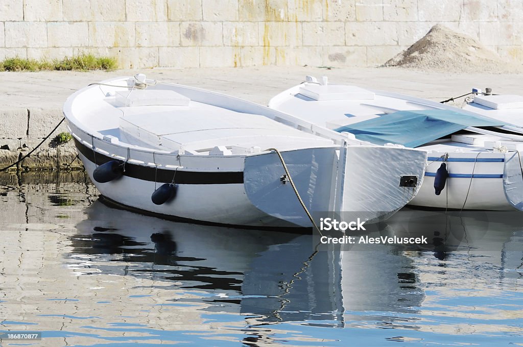 Wooden Boats Boat tied to dock Boardwalk Stock Photo