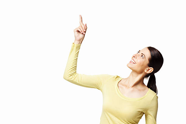 istock Attractive Woman Pointing Up - Isolated 186871400