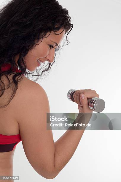 Rear View On Young Woman Exercising With Dumbbell Stock Photo - Download Image Now - 20-29 Years, Activity, Adult