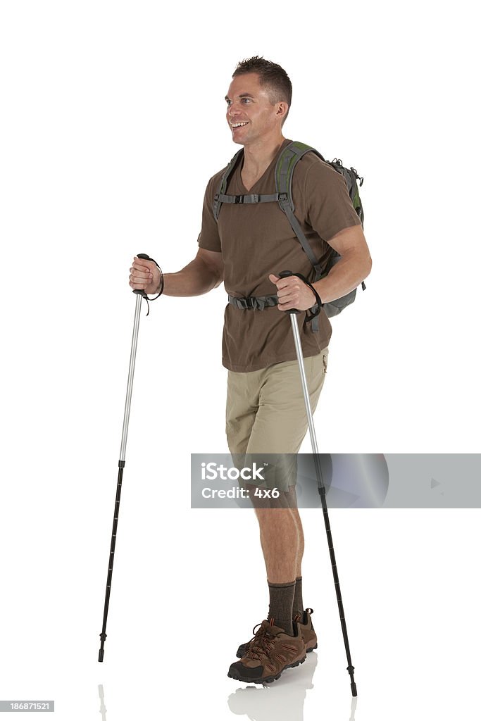 Male hiker with hiking pole Hiking Stock Photo