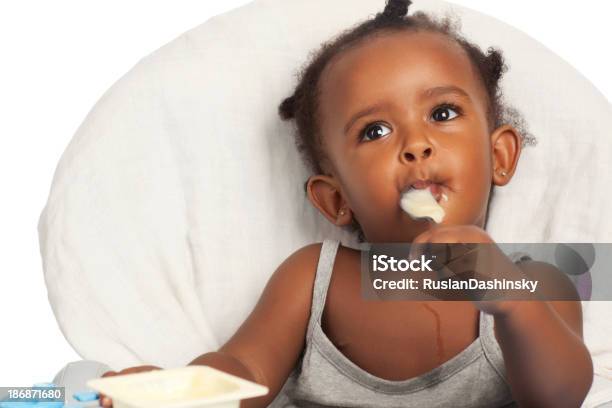 Baby Girl Eating With Spoon Stock Photo - Download Image Now - Eating, Baby - Human Age, Toddler