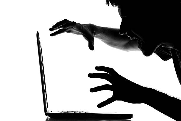 istock Male frustrated with his laptop 186871803