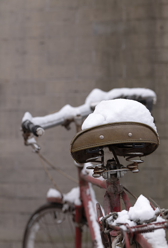 Closeup of bike Saddle with snow. Beijing, China