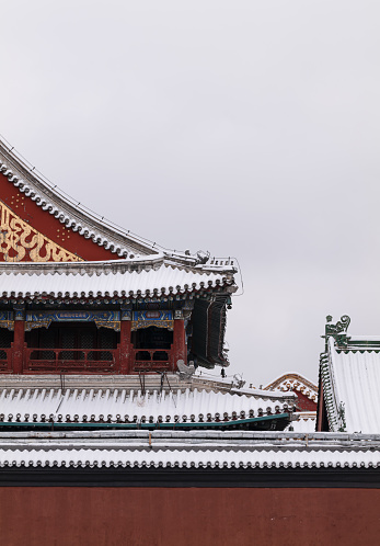 Chinese traditional building with snow against sky. Lama Temple, Beijing, China