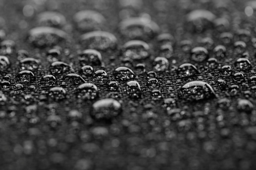 Waterproof textile after rain - covered with water drops