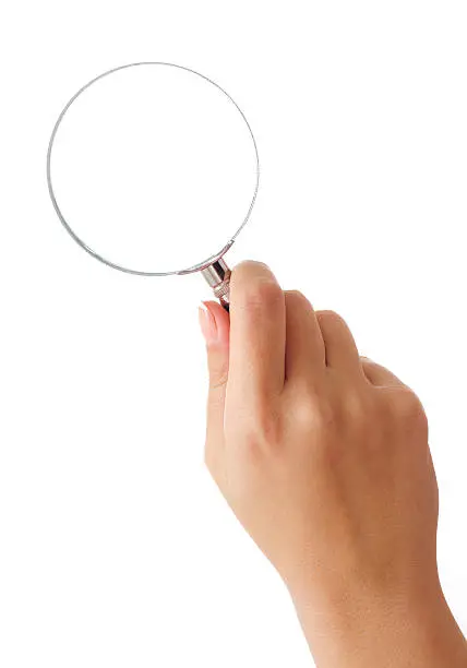 Photo of Hand holding magnifying glass