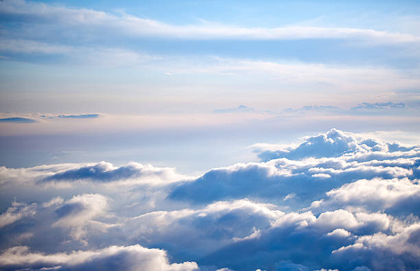 Aerial view of a cloudscape on a clear day clouds from above at 30000 feet aluxum stock pictures, royalty-free photos & images